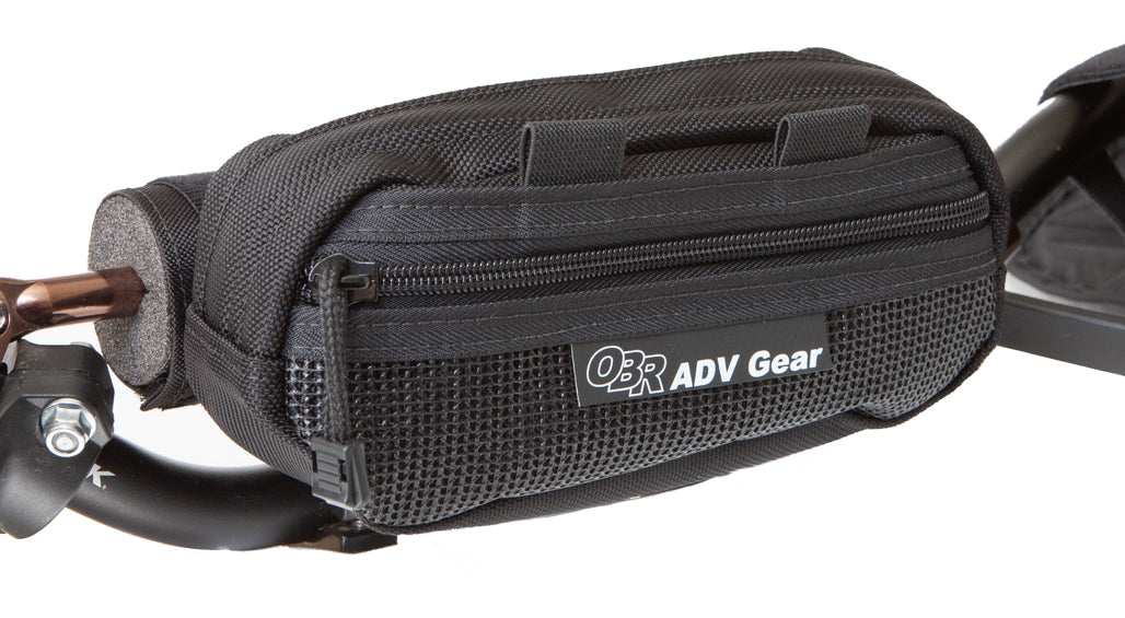 OBR ADV Gear Ledge Handlebar Bag: mounted on a padded motorcycle crossbar. Front mesh zippered pocket.
