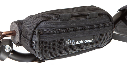 OBR ADV Gear Ledge Handlebar Bag: mounted on a padded motorcycle crossbar. Front mesh zippered pocket.