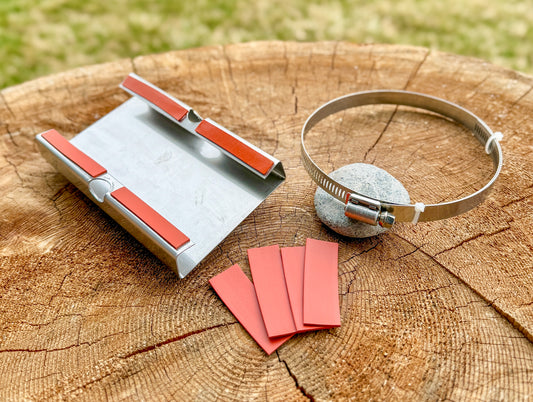 Heat shield, clamp, and anti-scratch pads.