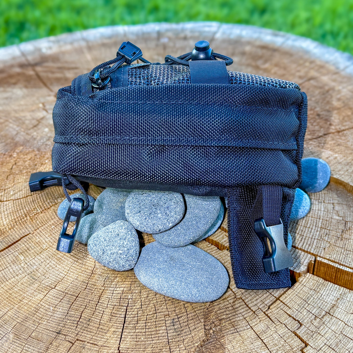 Switchback side view: mesh zipper pocket and shock cord on top.