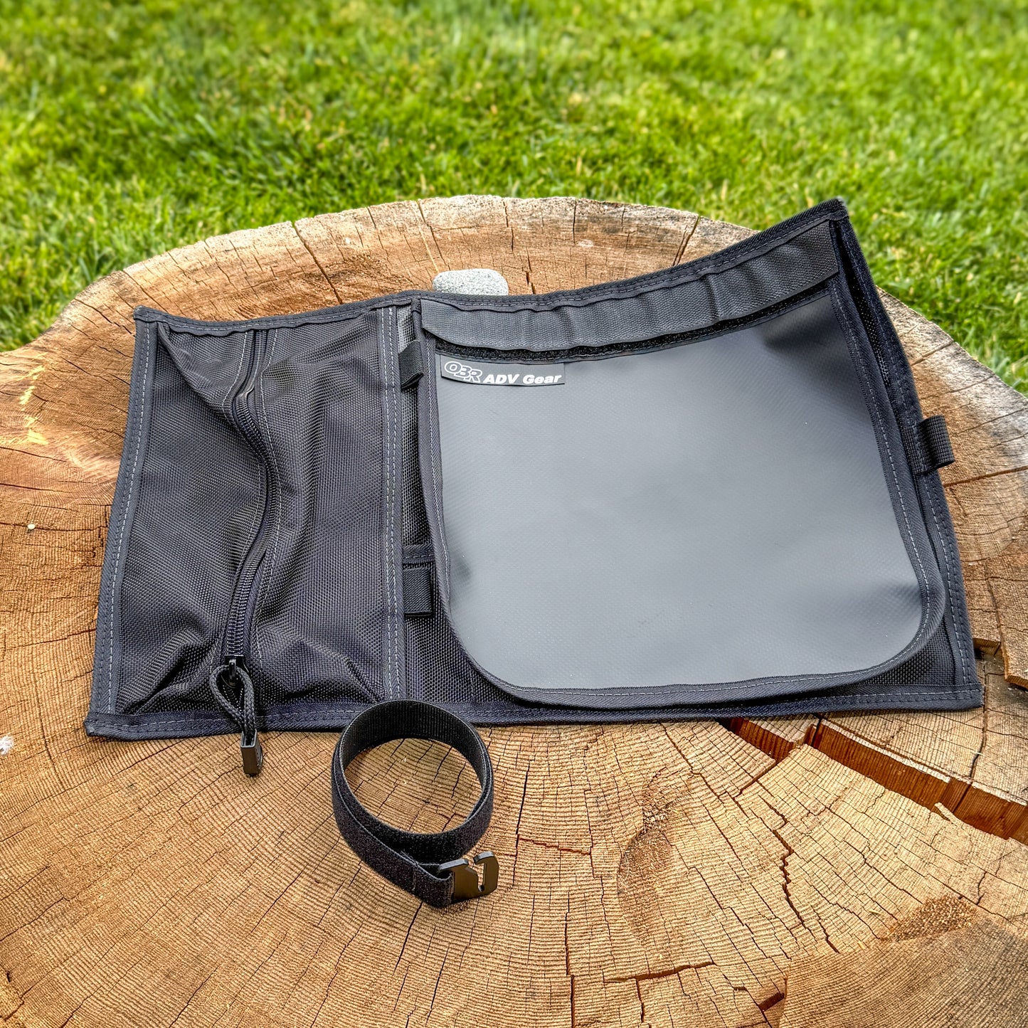 OBR Tool Roll unrolled and empty showing organized pocket layout, hub pad attached