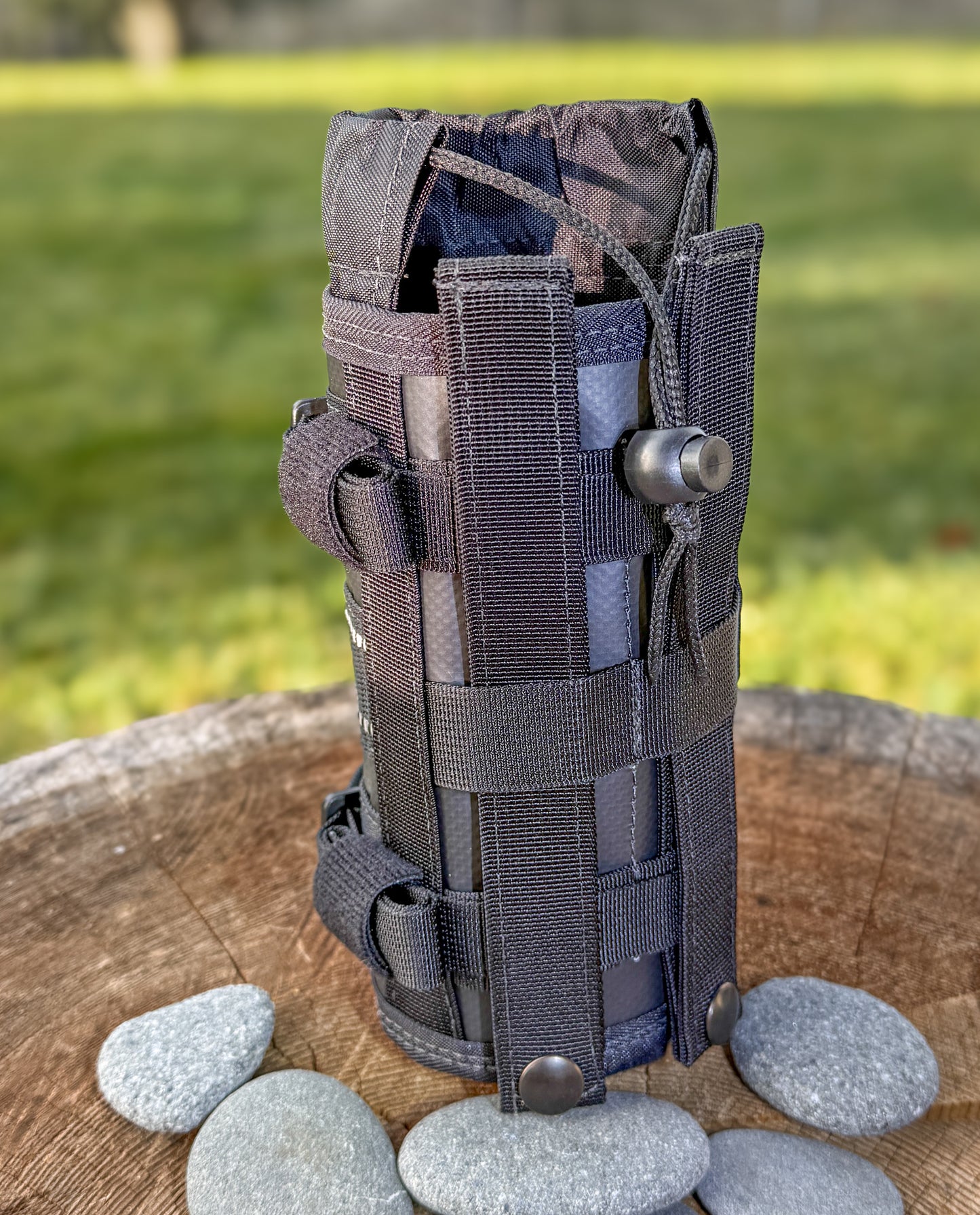 Universal motorcycle bottle holder with MOLLE loops and included MOLLE straps.